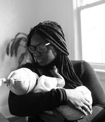 mother holding baby