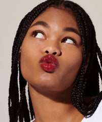 model with glossy lips, wearing raspberry jelly lip tint