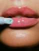 close up of Hailey Bieber's lips glazed with rhode peptide lip treatment