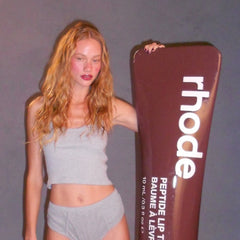 model holding a giant pbj lip tint