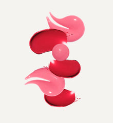 sweet pea lip tint + candy apple blush swatches on a white background