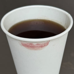 peptide lip tint stain on a coffee cup