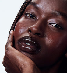 nyawuta wears peptide lip tint in espresso