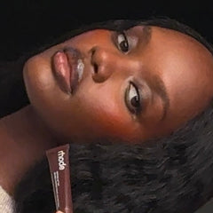 milly wears peptide lip tint in espresso