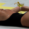 yellow cocktail with lemon twist and lemontini plt on HB's back