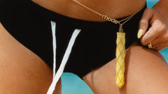 peptide lip tint lemontini in a gold chain with rhode logo