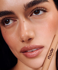 model wears peptide lip shape and peptide lip tint