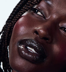 nyawuta wears peptide lip tint jelly bean