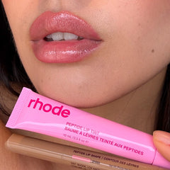 shannon holding peptide lip tint jelly bean and peptide lip shape press