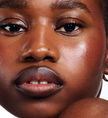 model wearing peptide lip shape in move