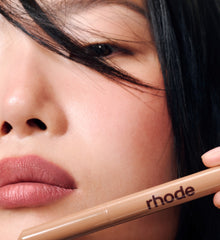model wearing peptide lip shape in press
