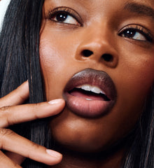 model wearing peptide lip shape in move