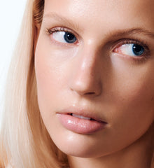 model wearing peptide lip treatment