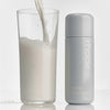 glazing milk next to a glass of milk