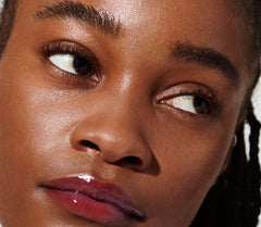 model wearing peptide lip tint n raspberry jelly