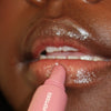 creator wearing peptide lip tint salty tan
