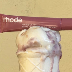 peptide lip tint salty tan on top of an ice cream