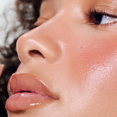 model wearing peptide lip tint in salty tan