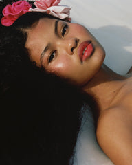 model with glazed skin and tinted lips