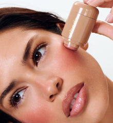 model holding pocket blush tan line
