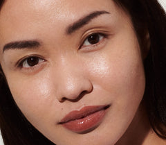 model wearing peptide lip tint in toast