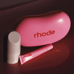 the birthday duo, featuring peptide glazing fluid, peptide lip tint in jelly bean, and a jelly bean shaped reusable pouch