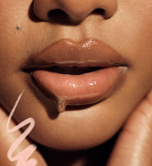 Model wears Peptide Lip Tint in shade Toast