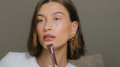 Hailey wears peptide lip tint in shade espresso