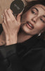 hailey bieber with rhode mirror and peptide lip shape