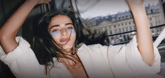 model wears rhode peptide eye prep