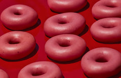 a group of Krispy Kreme Strawberry Glazed Doughnuts