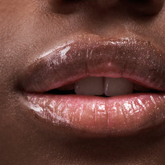 close up of model's lips, wearing peptide lip tint in jelly bean