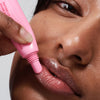 model applying peptide lip tint in jelly bean