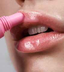 a close up of model's lips, wearing peptide lip tint in jelly bean