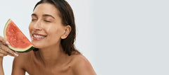 hailey bieber with watermelon, wearing peptide lip treatment (watermelon slice)