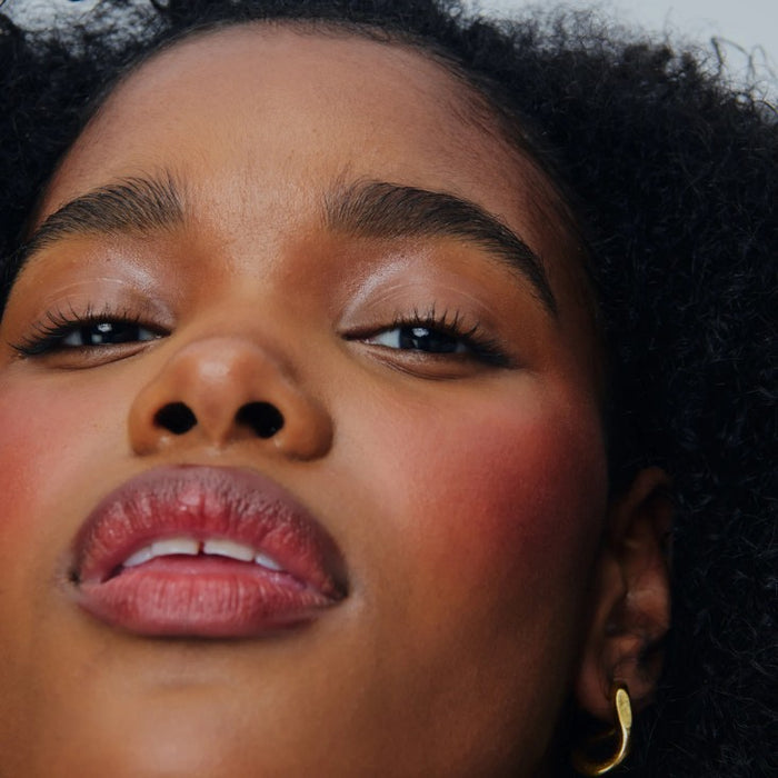 model wears peptide lip shape in sprinkle