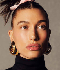Hailey wears Peptide Lip Tint in shade Ribbon