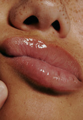 close up of model's glazed, glossy lips
