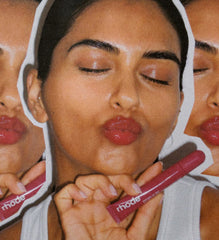 Model wears Peptide Lip Tint in shade Raspberry Jelly