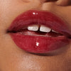 model with glossy lips, wearing raspberry jelly lip tint