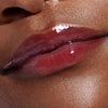 model with glossy lips, wearing raspberry jelly lip tint