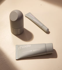 rhode skincare, clockwise from left: peptide glazing fluid, peptide lip treatment (salted caramel), barrier restore cream