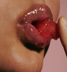 mouth close up, wearing peptide lip treatment, puckering with watermelon