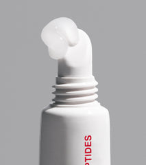 close up of the peptide lip treatment applicator, with formula squeezing out