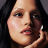 model with glossy lips wearing peptide lip treatment