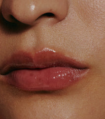 close up of model with glossy lips