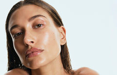 Hailey Bieber with glossy lips, wearing rhode peptide lip treatment