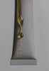 rhode peptide lip treatment - salted caramel, with product dripping down the tube