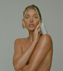 Model holding peptide glazing fluid, looking to camera