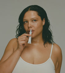 Model applying peptide lip treatment